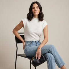Woman wearing a high neck cap sleeve summer top from My Store, stylish and breathable women's clothing top.