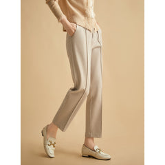 Women's wool tapered trousers in grey, made from Merino wool, featuring a tailored fit and classic style.
