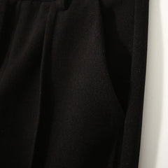 Women's wool tapered trousers by My Store, made from Merino wool, showcasing a stylish, fitted design with a smooth fabric finish.