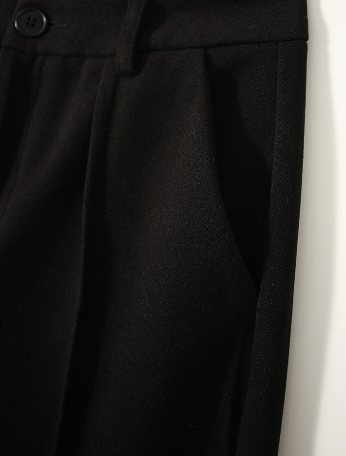 Women's wool tapered trousers by My Store, made from Merino wool, showcasing a stylish, fitted design with a smooth fabric finish.