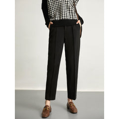 Women's wool tapered trousers by My Store, made from soft merino wool, featuring a classic fit and tapered leg design.