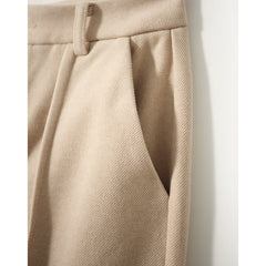 Women's wool tapered trousers in merino wool, stylish and comfortable pants for women, shown in a natural fit and fabric texture.