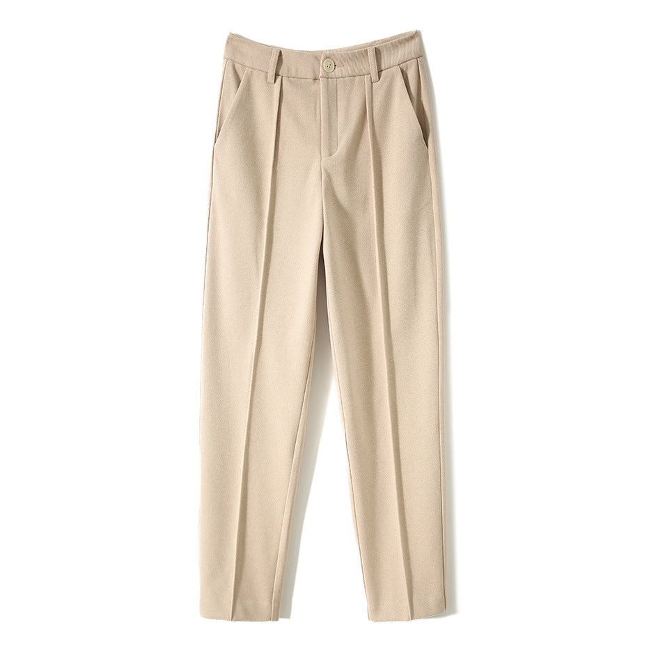 Women's wool tapered trousers by Merino, stylish and comfortable pants for women, shown in a natural pose.
