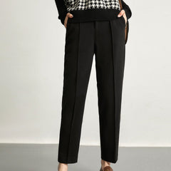 Women's wool tapered trousers made from merino wool, featuring a stylish fit and tailored design for everyday wear.