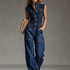 Dark blue denim sleeveless balloon jumpsuit with multiple pockets for women, featuring a relaxed fit and stylish design.