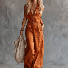 Rust orange cotton women's sleeveless V-neck jumpsuit with western-style pants, featuring a relaxed fit and stylish design.