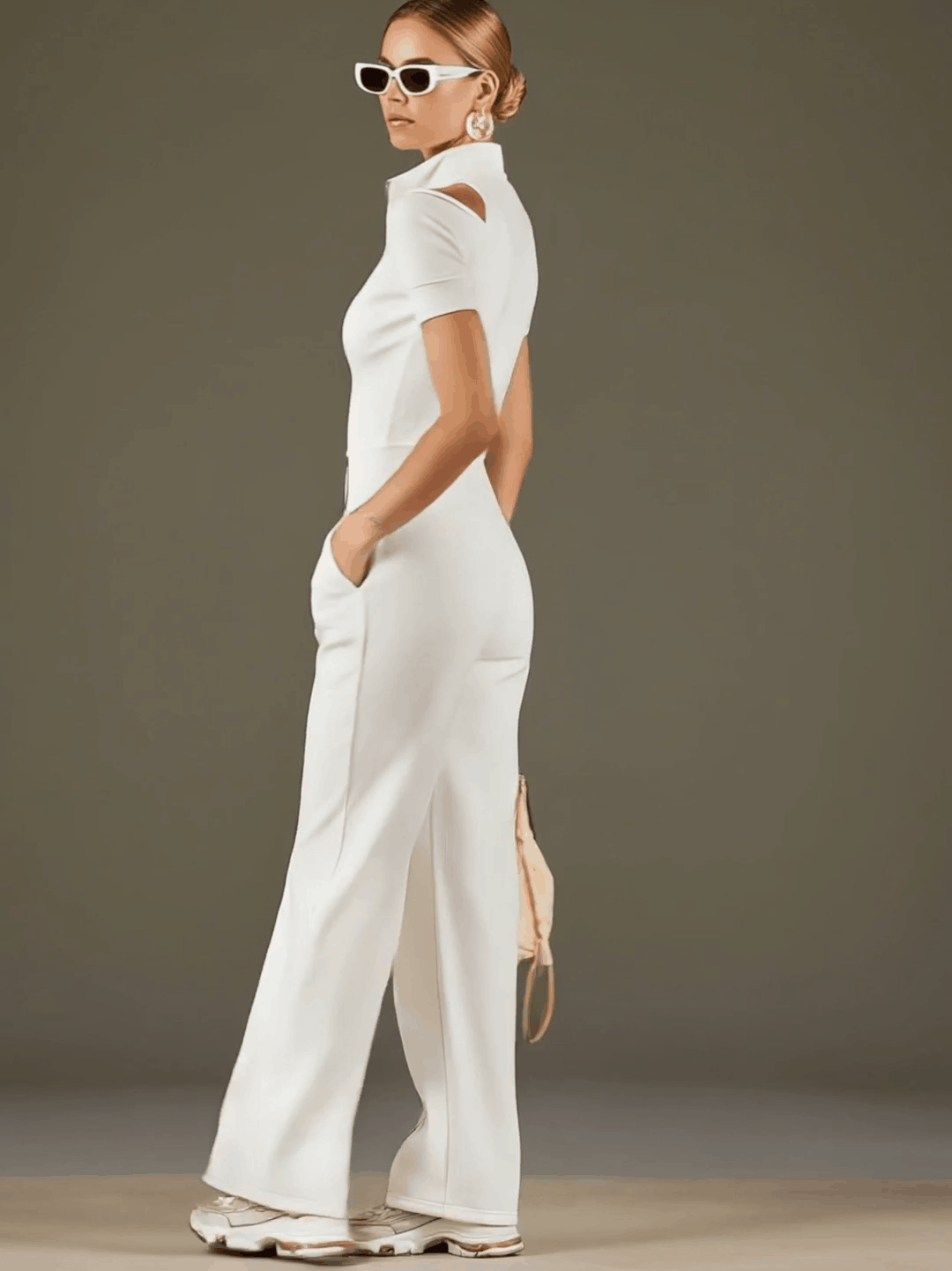 White cotton blend short sleeve wide-leg jumpsuit for women, featuring a relaxed fit and stylish design.