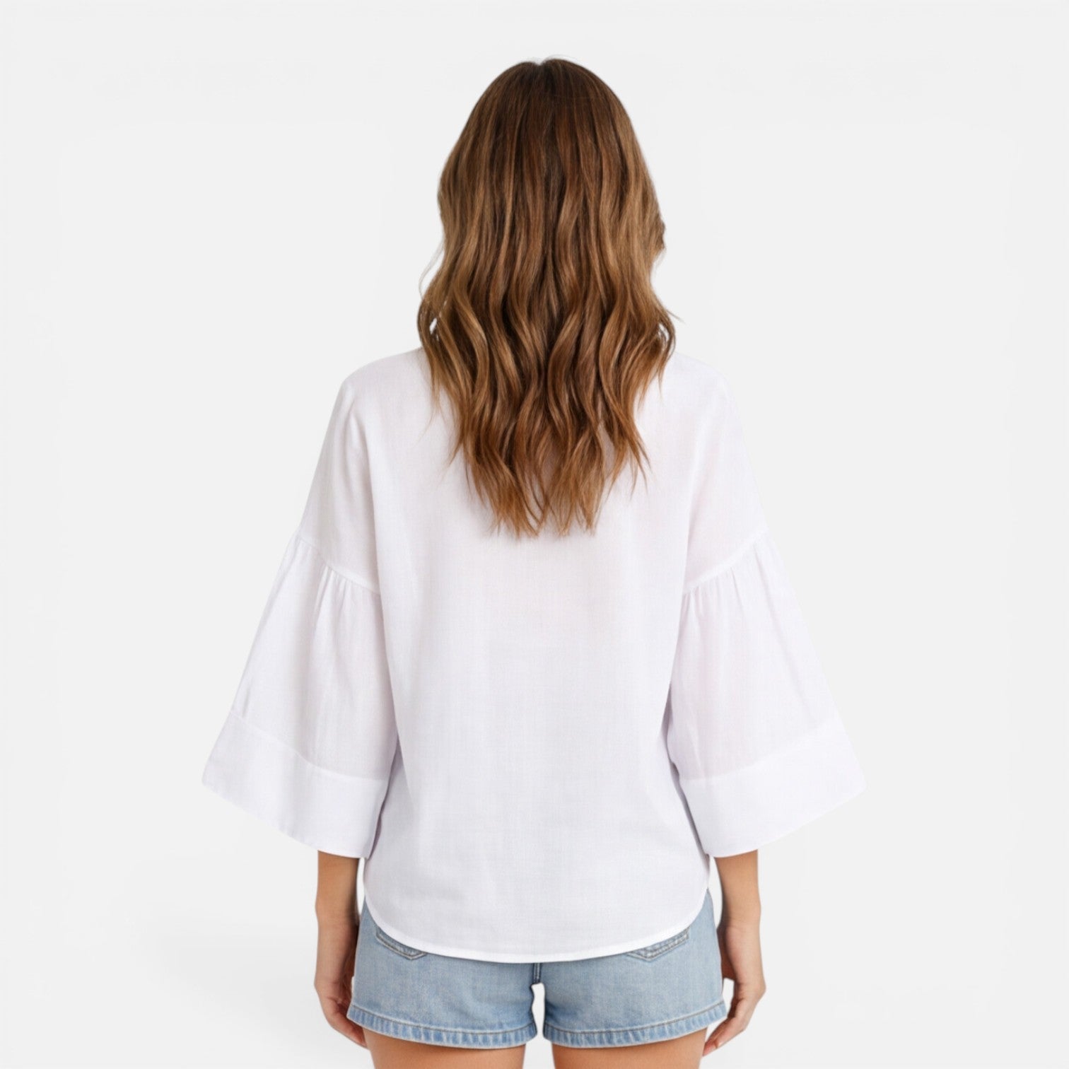 Lightweight women's summer blouse with a loose fit, ideal for vacation, shown in an oversized fit.