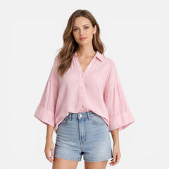 Lightweight women's summer blouse with a loose fit, ideal for vacation, shown in an oversized style with soft fabric.
