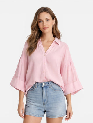 Lightweight women's summer blouse with a loose fit, ideal for vacation, shown in an oversized style with soft fabric.