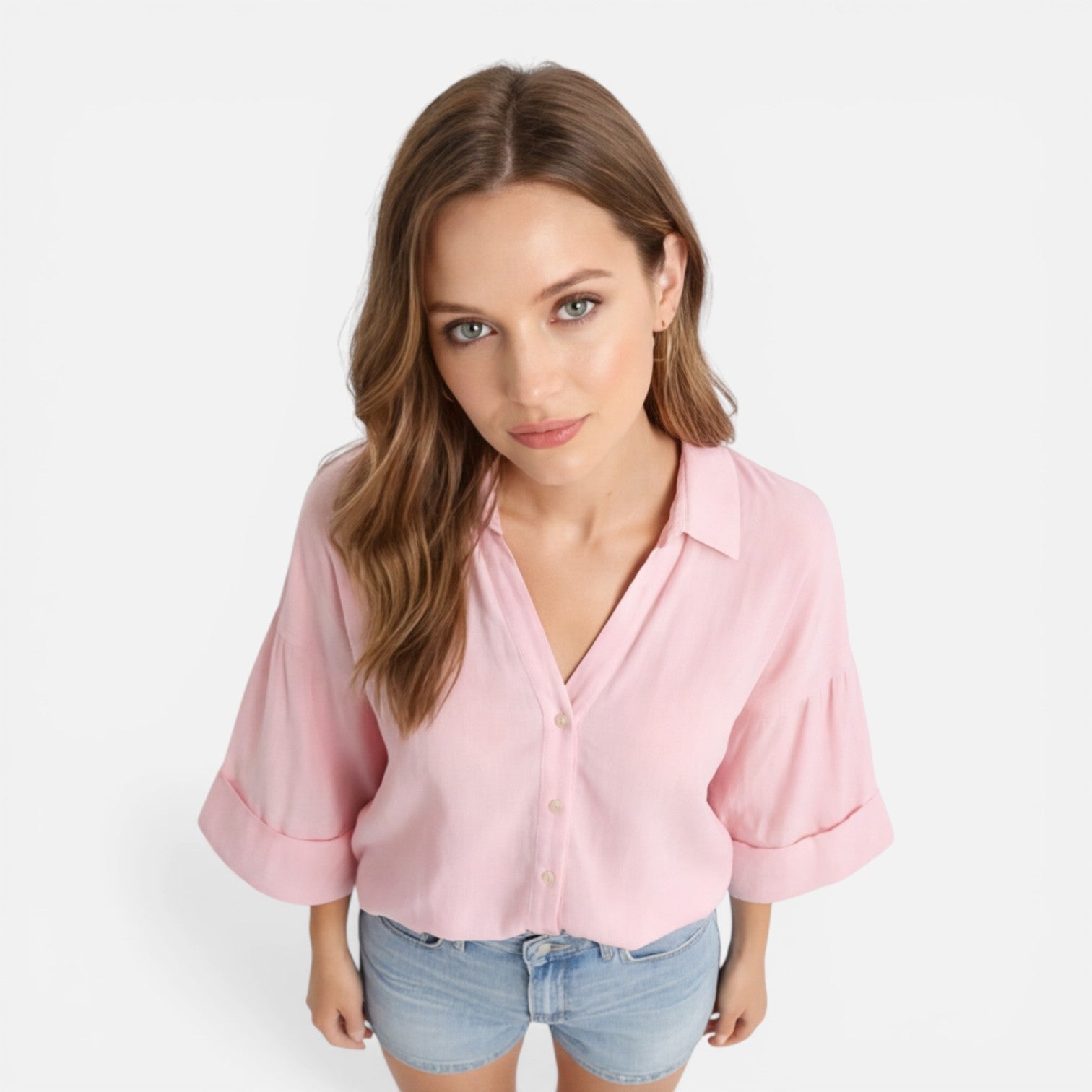 Lightweight women's summer blouse in loose fit style, perfect for vacation, styled on a model in a relaxed setting.
