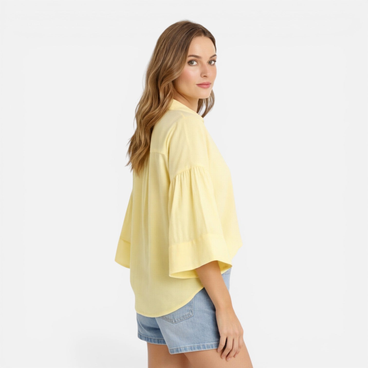Lightweight women's summer blouse with loose fit and relaxed style, perfect for vacation, shown in an oversized fit.