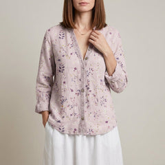 Pink floral summer blouse for women with V-neck and long sleeves, made of lightweight linen fabric.