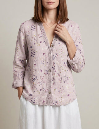 Pink floral summer blouse for women with V-neck and long sleeves, made of lightweight linen fabric.
