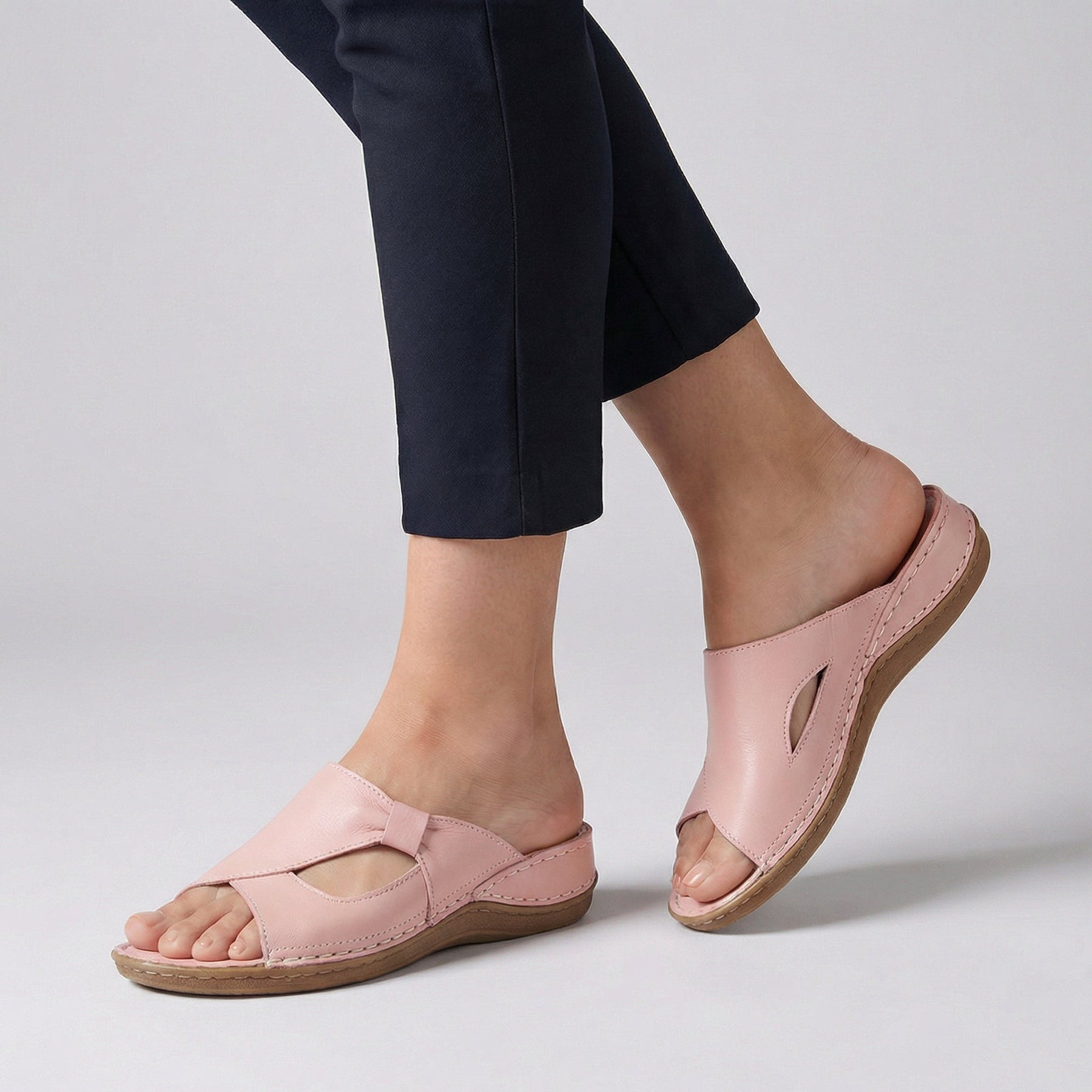 Pink open-toe slide sandals for women by Tammy Bradley, featuring a stylish and comfortable slip-on design for warm weather.