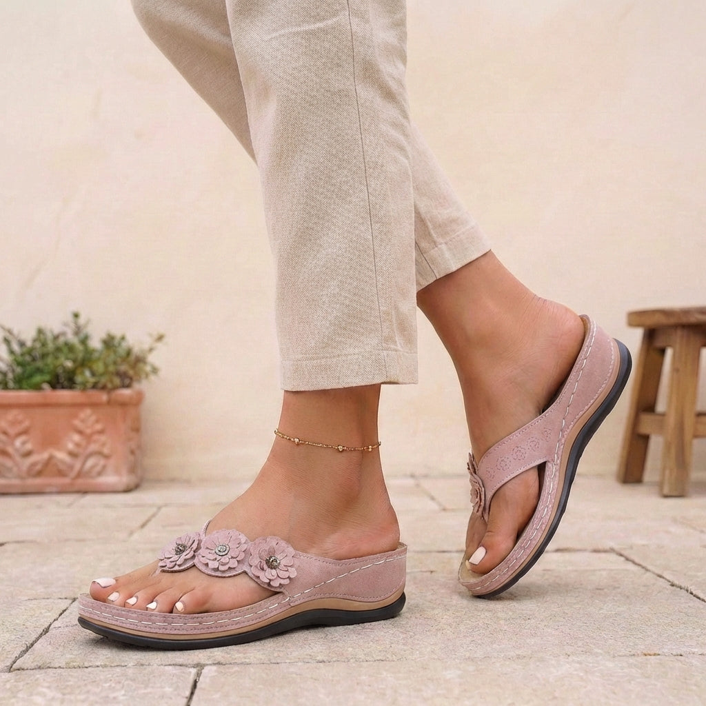 Pink floral appliqué wedge thong sandals for women by Tammy Bradley, featuring decorative flowers and comfortable wedge heel.