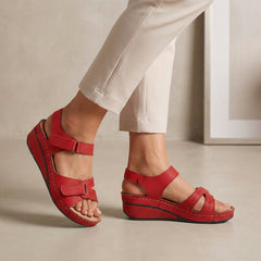 Red open-toe wedge-heel sandals for women by Tammy Bradley, featuring stylish straps and a comfortable wedge heel.
