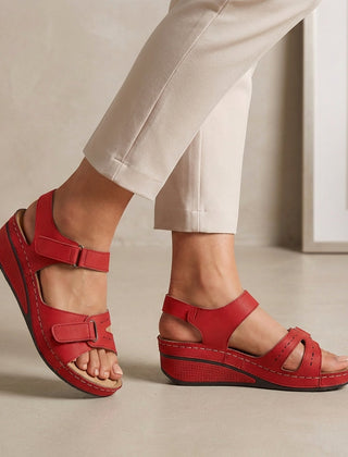 Red open-toe wedge-heel sandals for women by Tammy Bradley, featuring stylish straps and a comfortable wedge heel.
