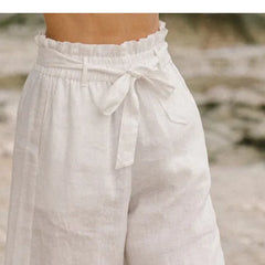 Linen wide-leg pull-on trousers for women, loose fit, breathable fabric, in neutral color, styled casually on a model.