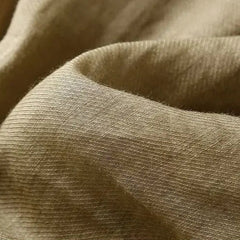 Light beige tapered linen trousers for women, loose pull-on style, casual and comfortable pants with a relaxed fit.