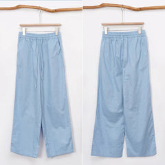 Light beige cotton linen wide-leg drawstring trousers for women, loose pull-on pants with relaxed fit and comfortable style.
