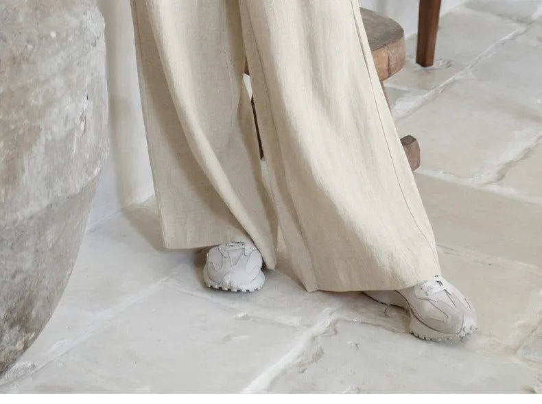 Linen wide-leg trousers for women, loose pull-on pants with relaxed fit, beige color, and soft fabric, perfect for casual wear.