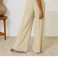 Light beige linen wide-leg trousers for women, loose pull-on pants with relaxed fit, comfortable and stylish for casual wear.