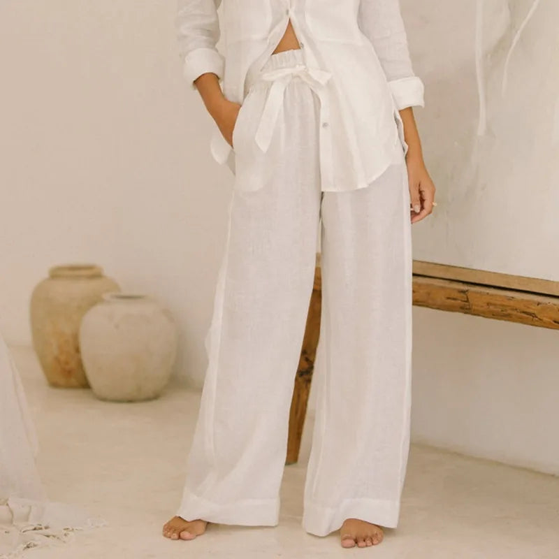 Light beige linen wide-leg pants for women with a loose pull-on design, featuring a relaxed fit and comfortable style.