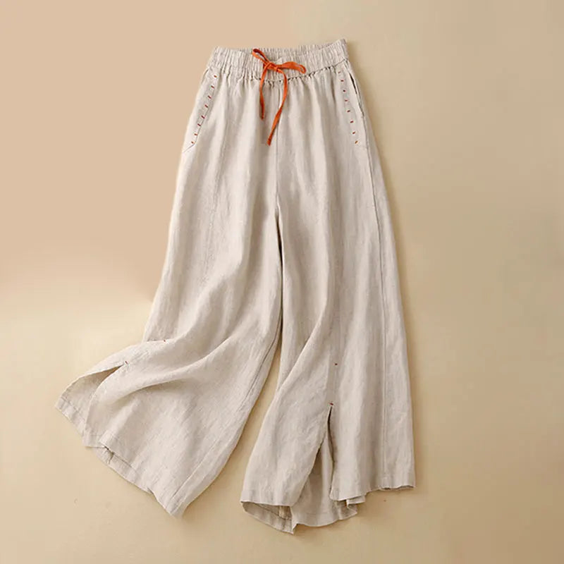 Women's linen wide-leg drawstring trousers featuring a loose fit and pull-on style, perfect for comfortable casual wear.