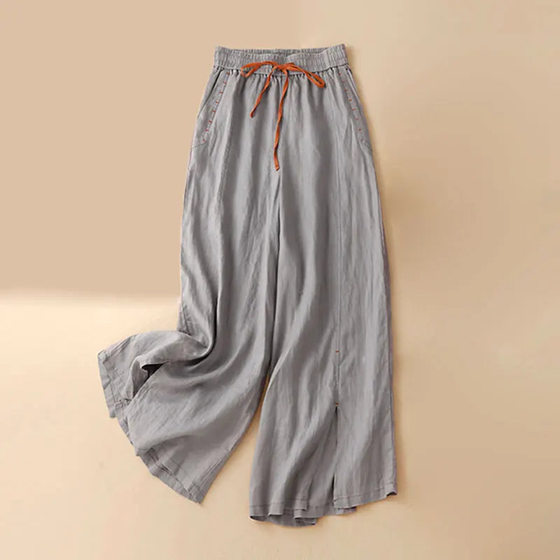 Women's linen wide-leg drawstring trousers with a loose fit, featuring a comfortable pull-on style and relaxed fit.