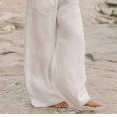 Linen wide-leg women's trousers with a loose pull-on design, featuring a relaxed fit and natural fabric texture.