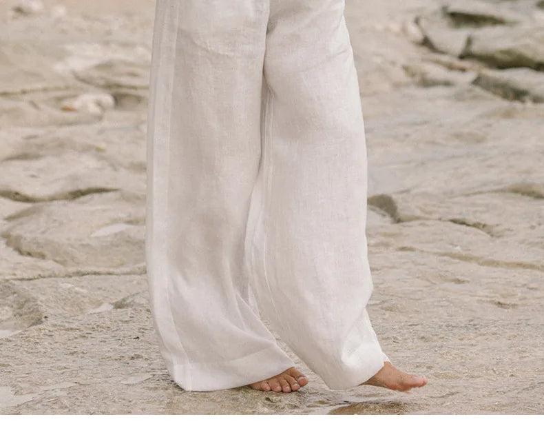 Linen wide-leg women's trousers with a loose pull-on design, featuring a relaxed fit and natural fabric texture.