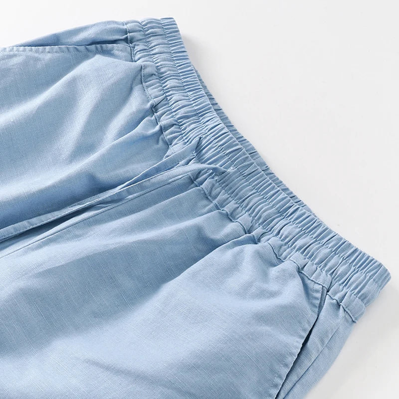 Women’s cotton linen wide-leg drawstring trousers with a loose fit, pull-on style, perfect for casual or relaxed wear.