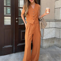 Women's white wide leg linen trousers with high waist, stylish and comfortable pants for casual or chic wear.