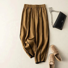 Women's striped wide leg linen trousers with a loose fit and pull-on design, perfect for casual summer wear.