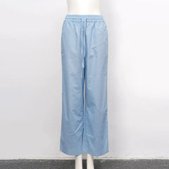 Light beige cotton linen wide leg women's trousers with drawstring waist and loose pull-on style.