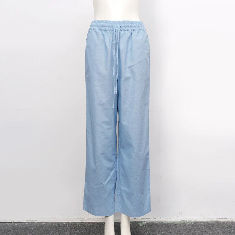 Light beige cotton linen wide leg women's trousers with drawstring waist and loose pull-on style.