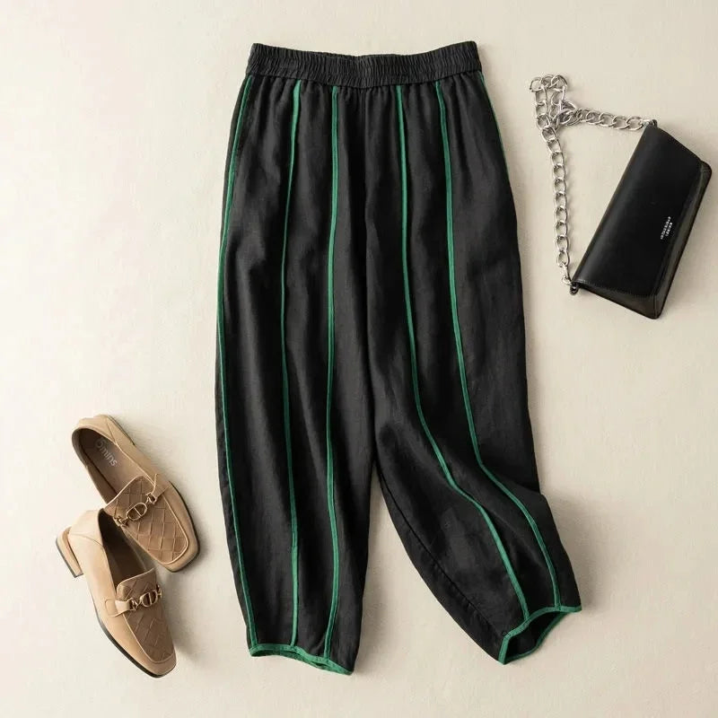 Light beige linen wide-leg women’s trousers with elastic waistband, loose pull-on style, comfortable and stylish for everyday wear.
