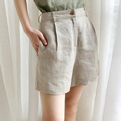 High-waist pleated linen shorts for women featuring tailored design, perfect for office or casual wear, in a light linen fabric.