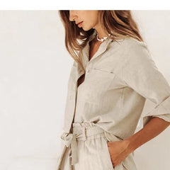 Light beige linen wide-leg trousers for women with a loose pull-on style, showing relaxed fit and comfortable waist.