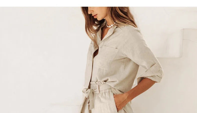 Light beige linen wide-leg trousers for women with a loose pull-on style, showing relaxed fit and comfortable waist.