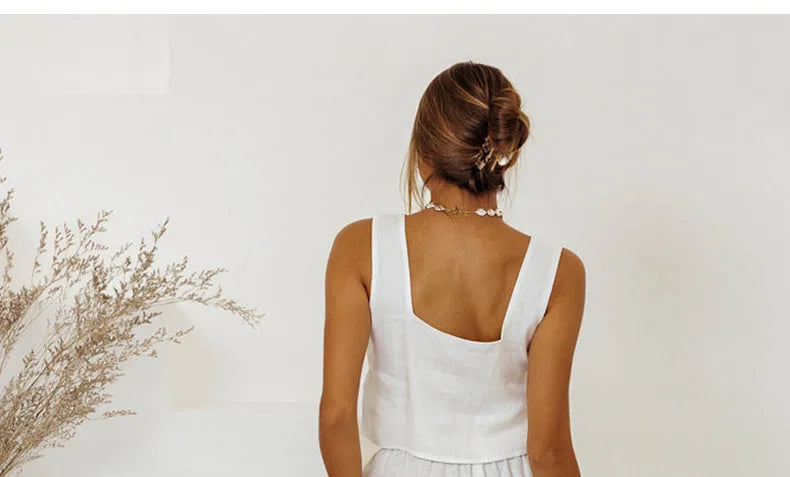 Linen wide-leg women's trousers with a loose, pull-on fit, shown in a relaxed style with natural fabric texture.