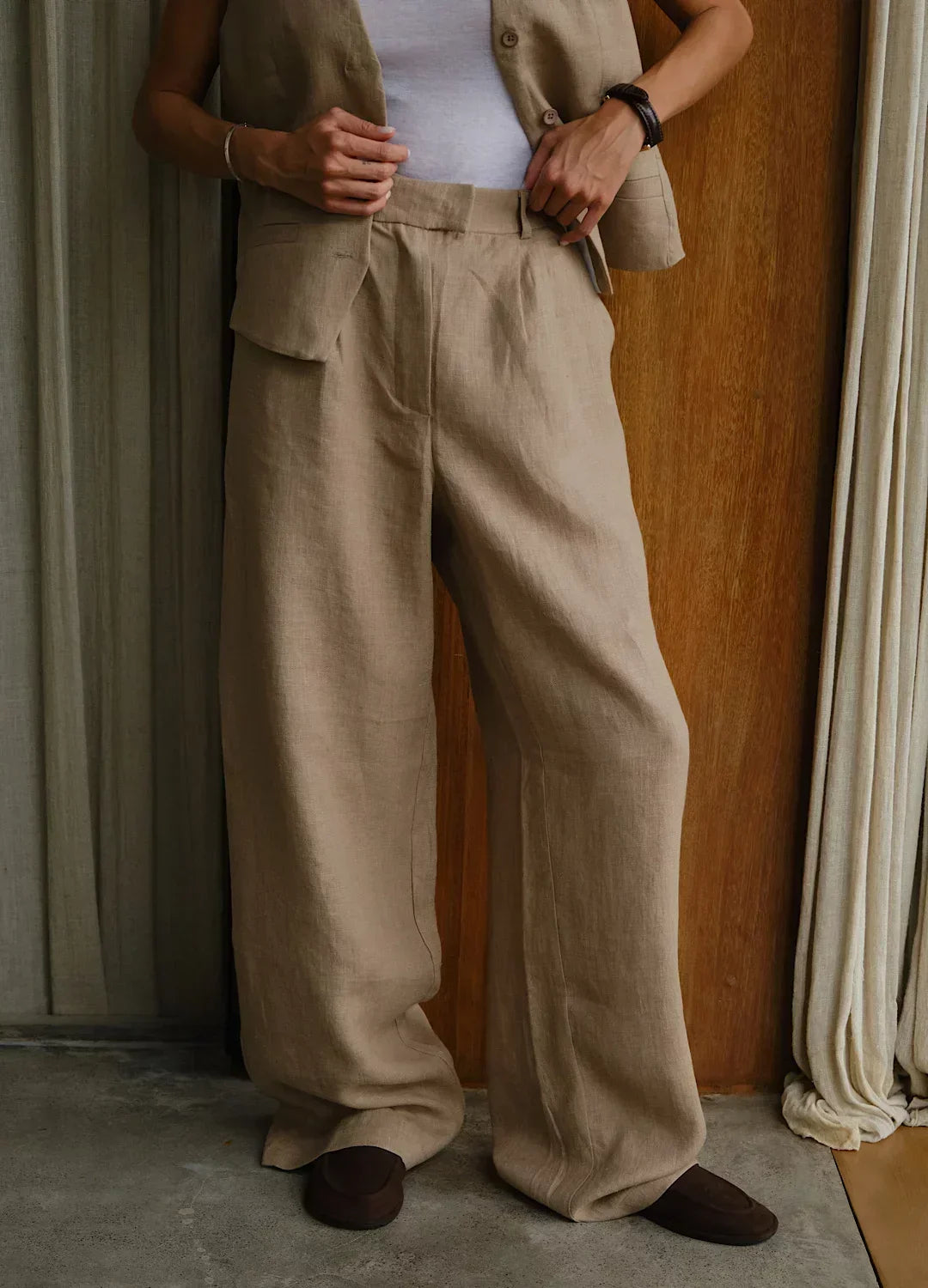 Women's high-waist wide-leg linen blend trousers with a loose pull-on style, featuring a relaxed fit and comfortable waistband.