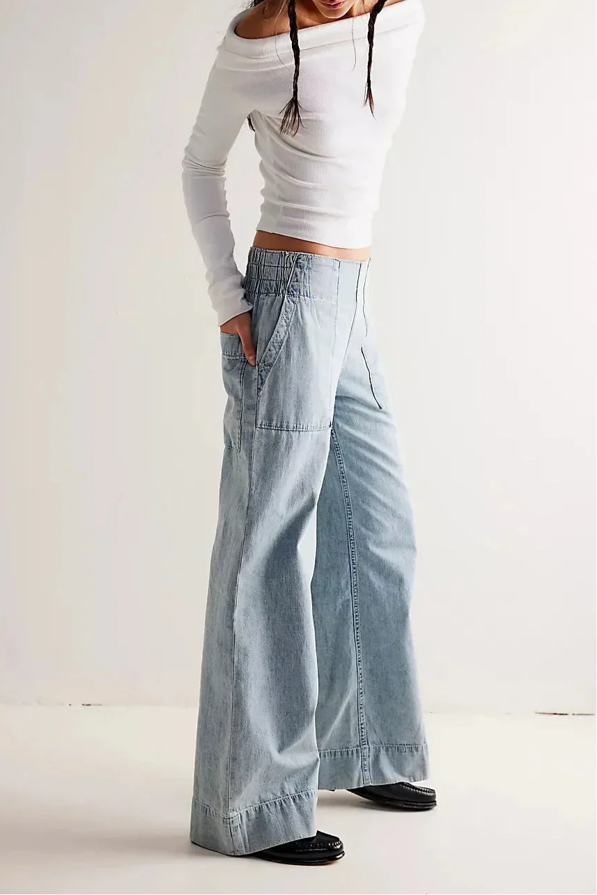 Blue denim wide-leg women's jeans with relaxed fit, casual pants for women, featuring classic denim fabric and stylish design.