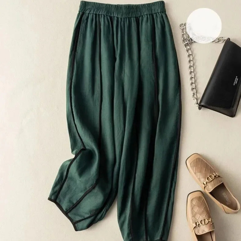 Light-colored striped wide-leg linen trousers for women, loose pull-on style, comfortable summer pants.