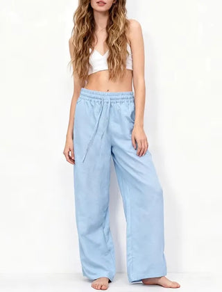 Women’s cotton linen wide leg drawstring trousers in a relaxed, loose fit with pull-on style, ideal for casual wear.