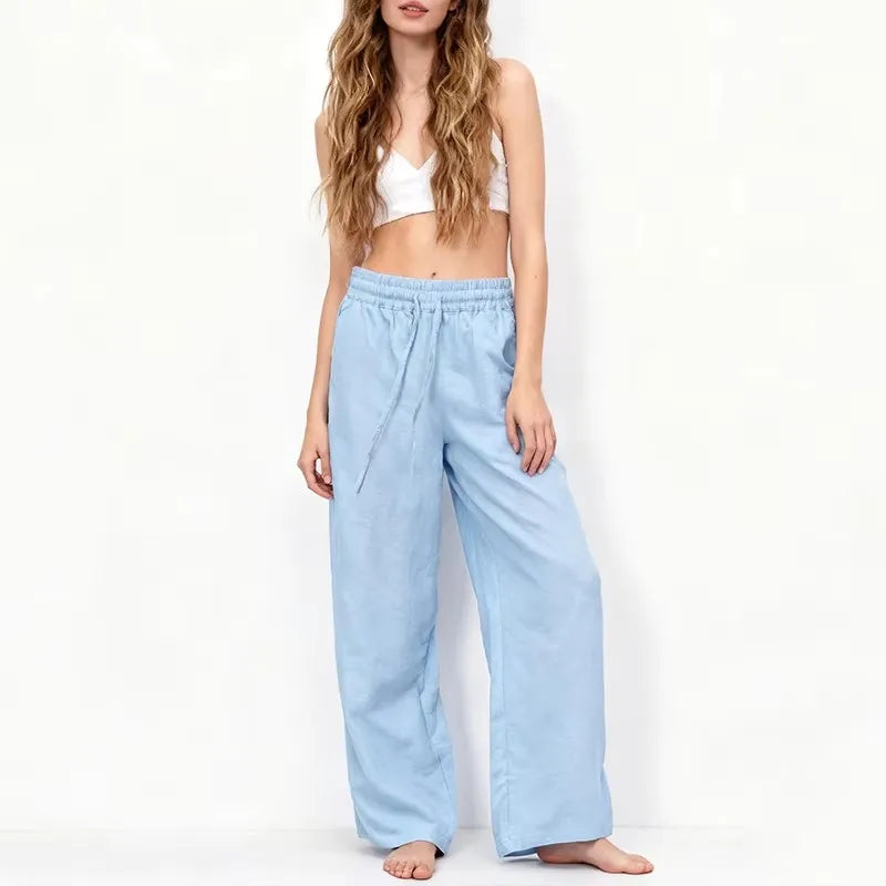 Women’s cotton linen wide leg drawstring trousers in a relaxed, loose fit with pull-on style, ideal for casual wear.