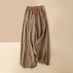 Women's linen wide-leg drawstring trousers with a loose fit, featuring a comfortable pull-on design and relaxed style.