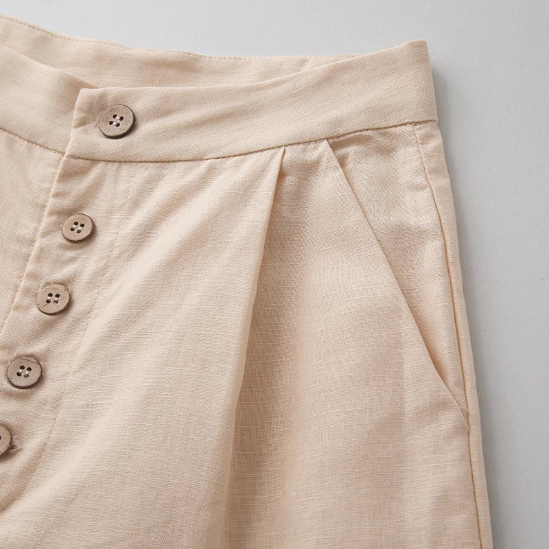 Women’s knit wide-leg elastic-waist trousers, loose pull-on pants with a relaxed fit, in soft fabric and neutral color.
