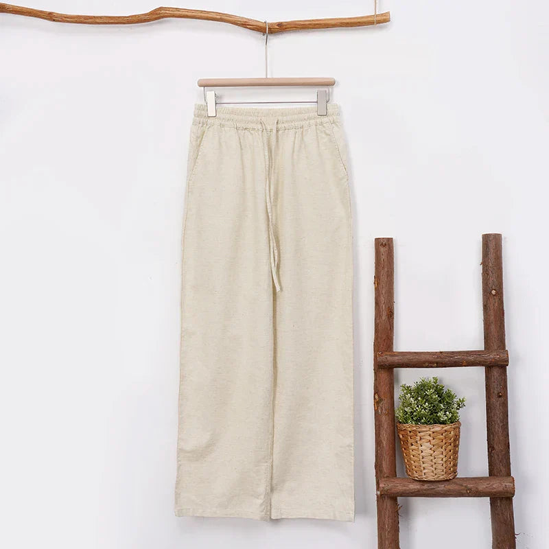 Women's cotton linen wide-leg drawstring trousers with a loose fit and pull-on design, perfect for casual and comfortable wear.